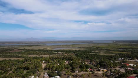 View-of-Cuautla-canal,-palm-trees-and-beach-houses