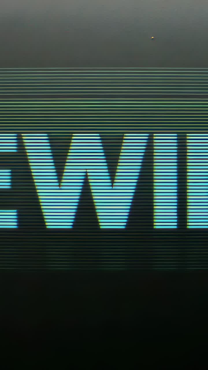 Vertical video: Shifting cyan block text on playback, with scanlines and green band evoking CRT