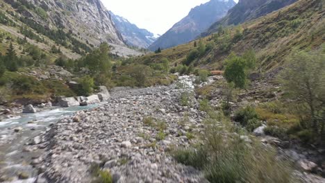 beautiful, fast moving aerial tracking shot of a river running through a canyon in france