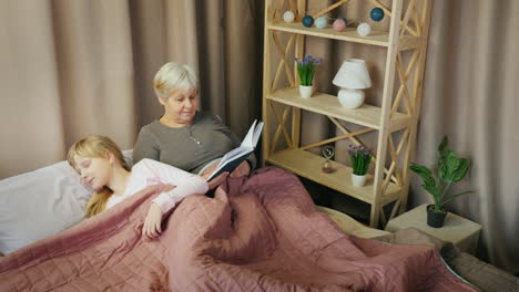 an elderly woman reads a fairy tale to a child 1