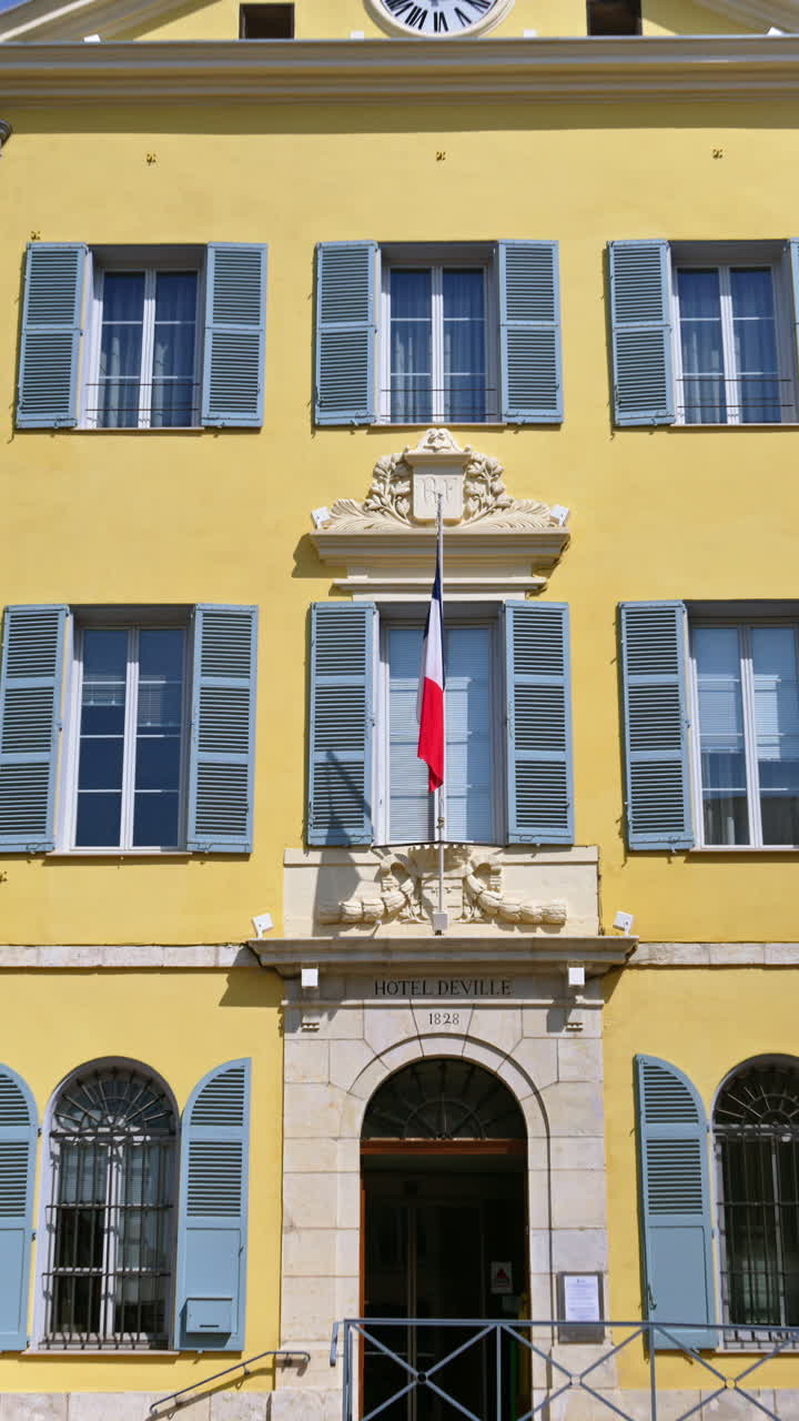 Antibes, France - 20 July, 2024: The facade of Ville d'Antibes Juan-les-Pins town hall. Vertical