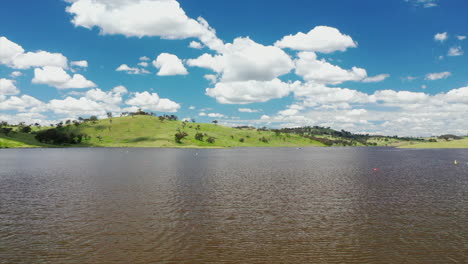 Aerial:-Drone-shot-flying-over-a-large-river-outside-of-Bathurst,-in-NSW-Australia