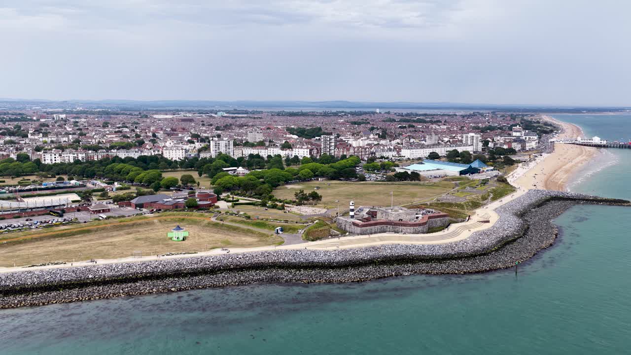 Southsea coast aerial view flying above the Solent towards Portsmouth waterfront urban seafront