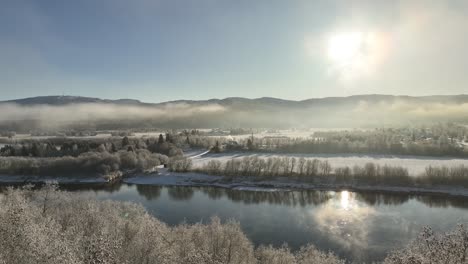 aerial shot of a misty layered norwegian landscape