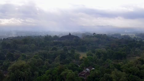borobudur buddhist stupa in middle of tropical misty jungle of central java