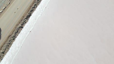 drone aerial parallax over pink lake macdonnell in south australia