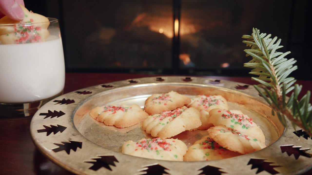 Woman Grabs a Christmas Cookie and Dips it in Milk in 4k