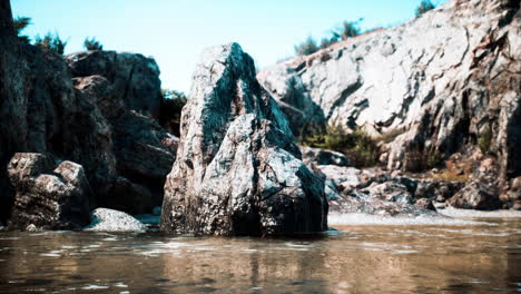 serene rock formation in a calm river