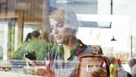 beautiful woman video messaging conference call tablet in cafe