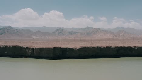 power lines across qinghai province desert area, electricity supply