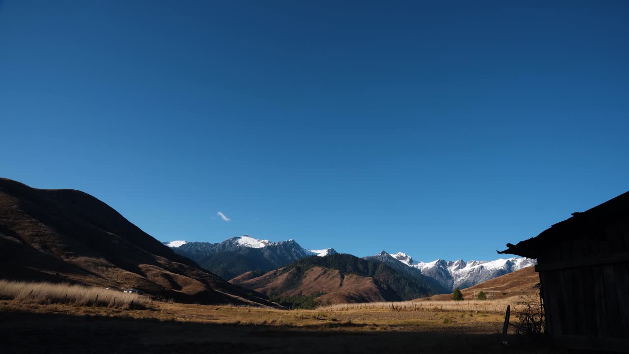 Time lapse of the sun falling behind the mountains and make a shadow and beautiful rural scene