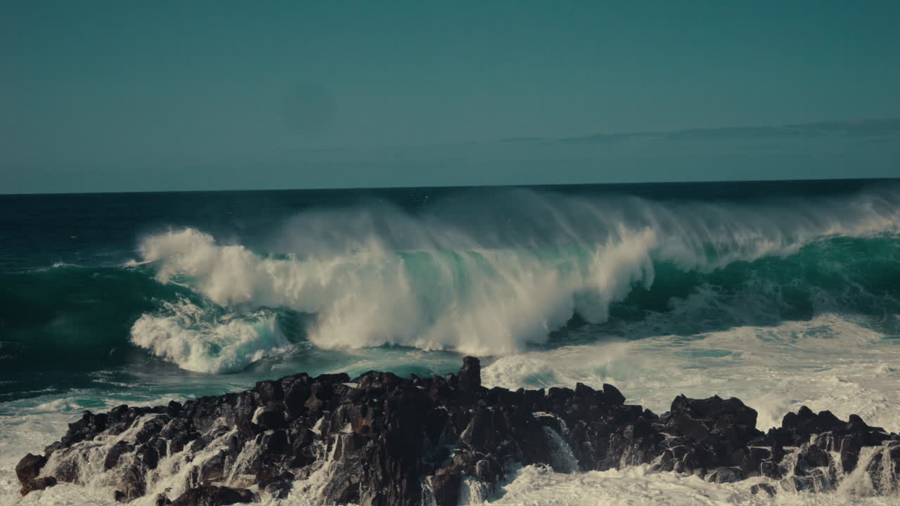 Powerful Ocean Waves Crashing on Rocky Shore