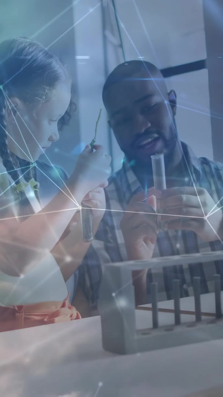 Vertical video: Man teaching tube use in STEM, hand urging girl placing in rack with cloud overlay