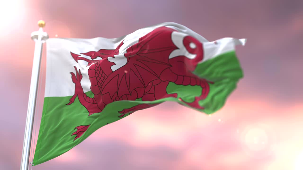 bandera de gales agitando en el viento en lento al atardecer, bucle