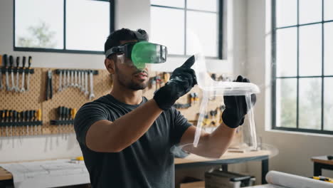 man using vr/ar headset to design a chair in a workshop