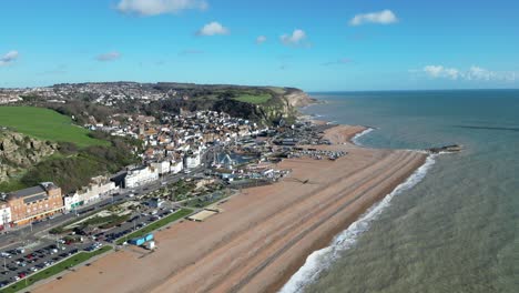 aerial drone shot of hastings uk, high wide angle shot of beach, old town and east hill cliffs