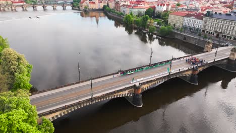 aerial view of legion bridge over vltava river with sky reflection, prague