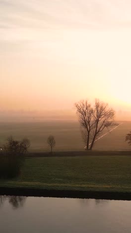 sunrise over a dutch countryside field