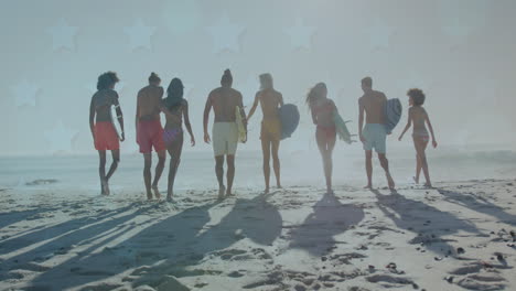 animation of stars over back of diverse friends walking on beach with surfingboards