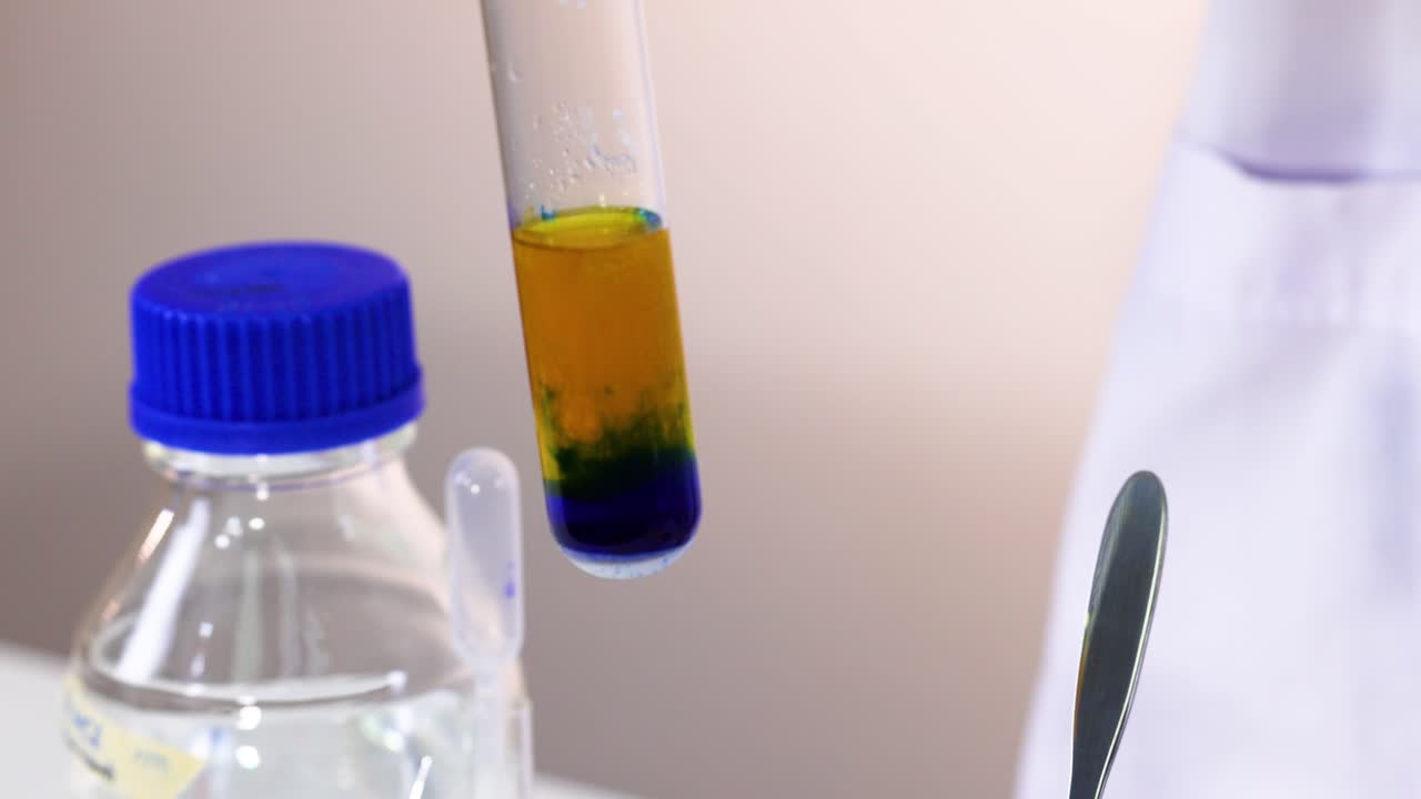 Chemical reaction with color change in test tube