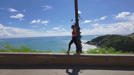 woman hiking along the coastline