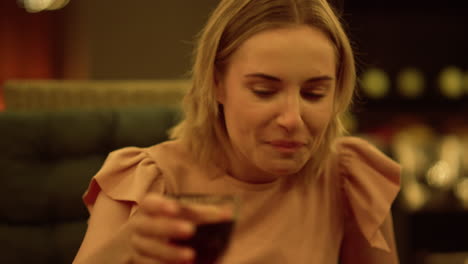 Woman-drinking-red-wine-at-dining-table