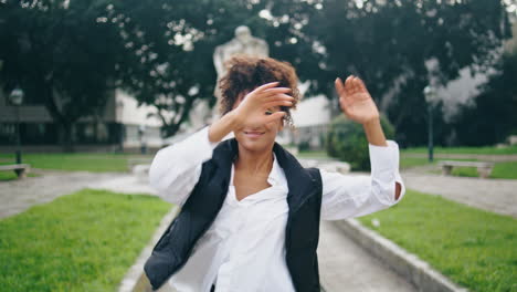 Talented-woman-performer-dancing-in-park-practicing-freestyle-closeup-vertically