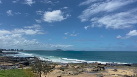 beautiful wide shot looking up the queensland coast from caloundra, north over the rocky shoreline towards mount coolum