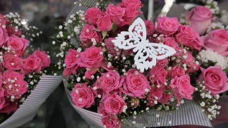 bouquet of pink roses with butterfly decoration