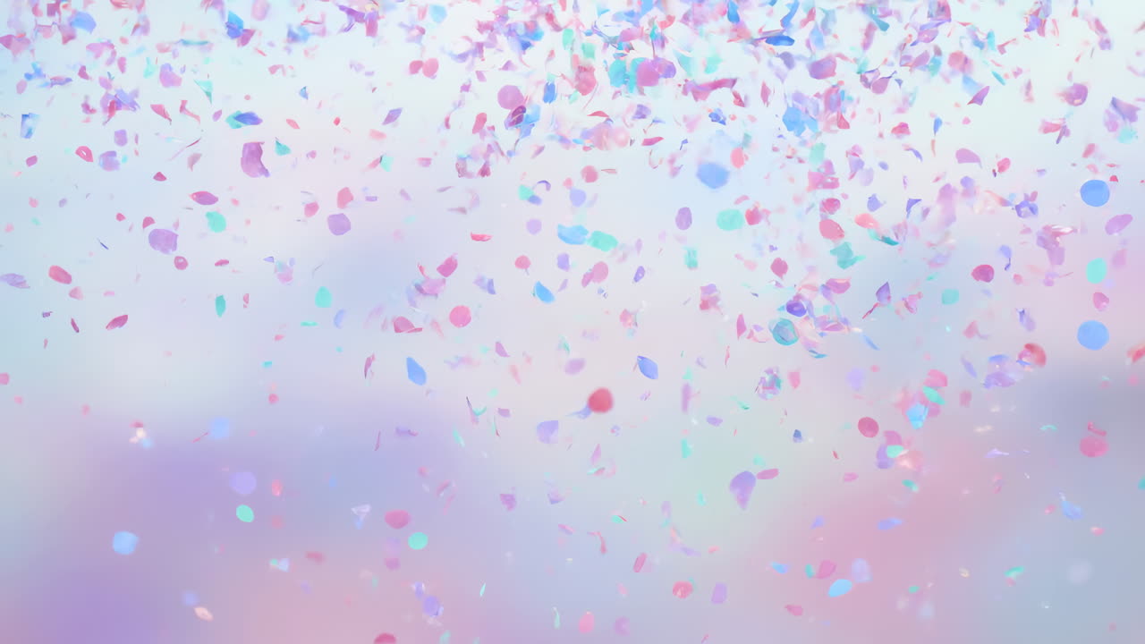 Blødt pastelkonfetti falder over bokeh, sarte kronblade svæver i slow motion hen over sløret lavendel og mynte.