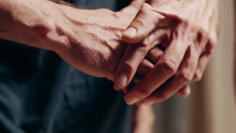 close-up of clasped or intertwined hands