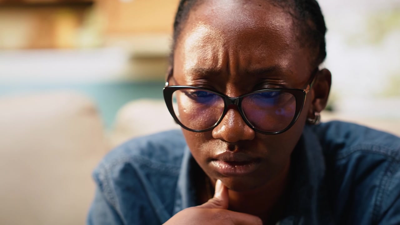 Close up of young woman frowning about ambiguous tasks at home