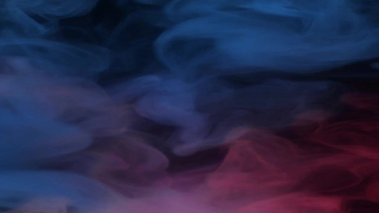 Abstract Pink and Blue Smoke Swirling on Black Background