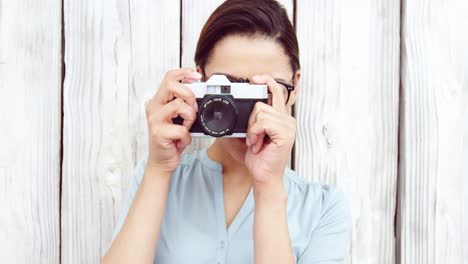 photographer taking photo with vintage camera