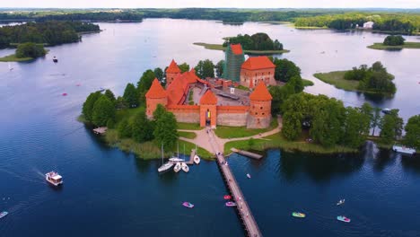 aerial drone view of trakai castle in the middle of a lake in lithuania