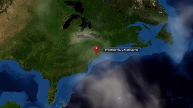Satellite view zooms from outer space directly to Philadelphia, United States with location pin marker. Includes NASA public domain imagery.