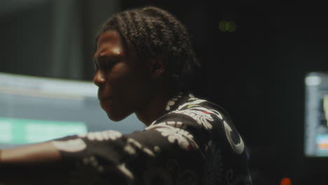 african american musician recording new track in audio studio
