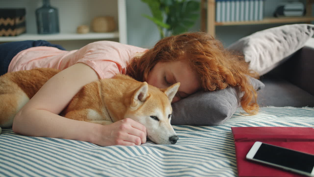 Woman and Dog Sleeping Together