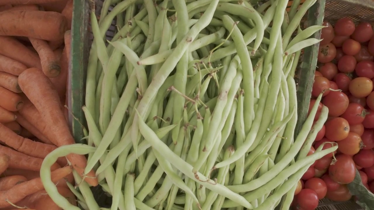Fresh Vegetables Displayed in Baskets at a Market