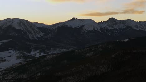 silverthorne colorado sunrise sunset copper mountain resort buffalo mountain i70 ski town aerial drone rocky mountains peak ten mile range clouds lake dillon frisco national forest circle right motion