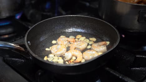 Cooking-shrimp-in-a-cooking-pan-in-slow-motion