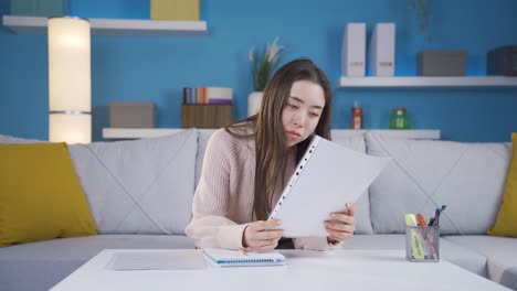 asian young woman falling asleep in her home office.