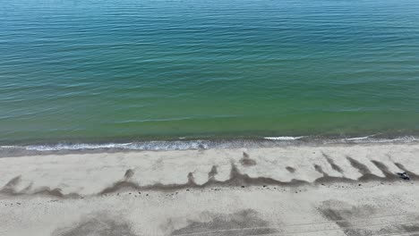 aerial view of a person relaxing on a secluded beach