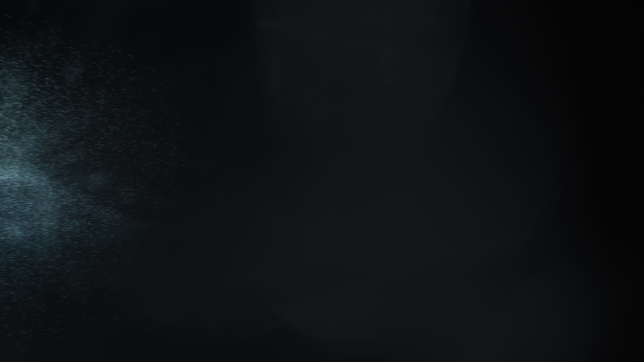 Particles from Comet in Deep Space with Ice Debris Flying Off into Black Background. Bright Center of Object Hurtling Through Galaxy. 3D Animation Rendering of 3i Atlas