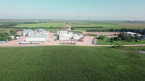 Aerial-view-of-the-storage-bins-and-warehouses-of-a-cover-seed-agribusiness-in-the-USA,-but-exports-seeds-around-the-world