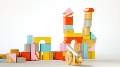 Wooden-toy-cannon-demolition-of-a-castle-made-out-of-colorful,-wooden-blocks.-Collapse-of-toy-construction-bringing-joy-and-happiness-to-its-creator.-Young-kid-learning-basics-of-physics.