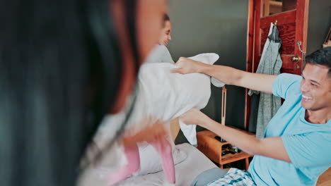 Playful,-bedroom-and-a-happy-family-pillow-fight