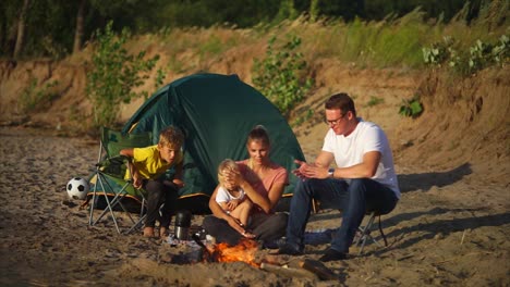 family camping trip by the river