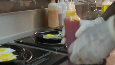 african american woman cooking eggs