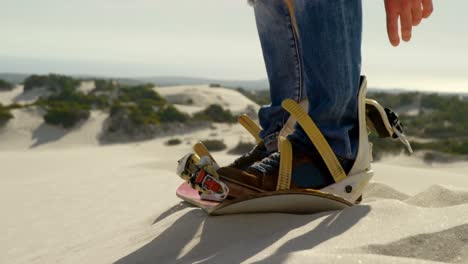 Man-wearing-sandals-in-the-desert-4k